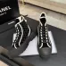Chanel Women’s High-Top Boots – Black Suede with White Stitching & CC Logo Toe Cap #A69905