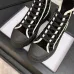 Chanel Women’s High-Top Boots – Black Suede with White Stitching & CC Logo Toe Cap #A69905