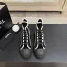 Chanel Women’s High-Top Boots – Black Suede with White Stitching & CC Logo Toe Cap #A69905