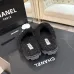 Chanel Women’s Black Fuzzy Slippers with White CC Logo, Soft Shearling Interior, Platform Sole #A69880
