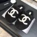Chanel Women’s Black Fuzzy Slippers with White CC Logo, Soft Shearling Interior, Platform Sole #A69880