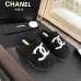 Chanel Women’s Black Fuzzy Slippers with White CC Logo, Soft Shearling Interior, Platform Sole #A69880