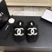 Chanel Women’s Black Fuzzy Slippers with White CC Logo, Soft Shearling Interior, Platform Sole #A69880
