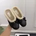 Chanel Women’s Black Leather Slippers with Cream Shearling Lining & Gold-Tone CC Bow Detail #A69899