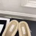 Chanel Women’s Black Leather Slippers with Cream Shearling Lining & Gold-Tone CC Bow Detail #A69899