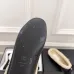 Chanel Women’s Black Leather Slippers with Cream Shearling Lining & Gold-Tone CC Bow Detail #A69899
