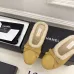 Chanel Women’s Black Leather Slippers with Cream Shearling Lining & Gold-Tone CC Bow Detail #A69900
