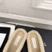 Chanel Women’s Black Leather Slippers with Cream Shearling Lining & Gold-Tone CC Bow Detail #A69900