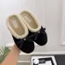 Chanel Women’s Black Velvet Slippers with Cream Shearling Lining & Gold-Tone CC Bow Detail #A69901