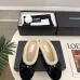 Chanel Women’s Black Velvet Slippers with Cream Shearling Lining & Gold-Tone CC Bow Detail #A69901