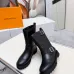 Louis Vuitton Women’s Black Leather Mid-Calf Boots with Adjustable Buckle Straps and Chunky Tread Sole #A69872