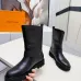 Louis Vuitton Women’s Black Leather Mid-Calf Boots with Adjustable Buckle Straps and Chunky Tread Sole #A69872