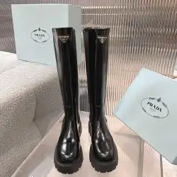 Prada's Sleek Black Knee-High Boots Featuring Glossy Texture and Iconic Logo #B54538