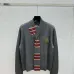2025  Miu Miu Women's Striped Knit Polo Sweater with a Quarter-Zip or Button Placket and Miu Miu Logo #B54795